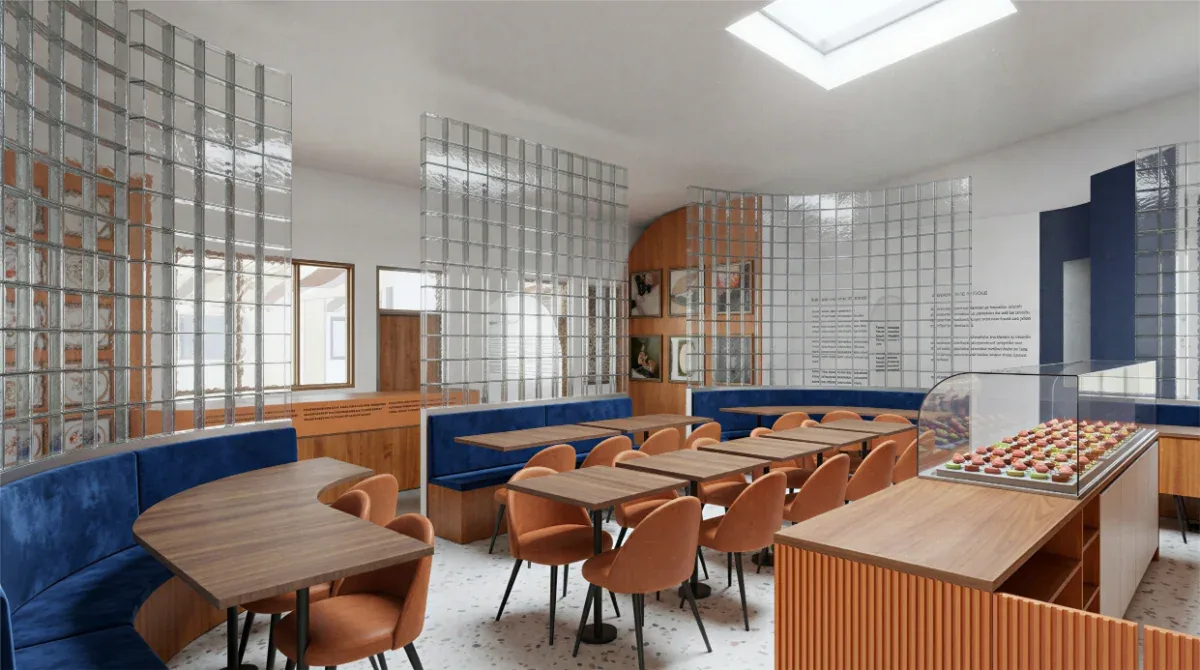 Salle de dégustation du café Manoré, banquettes bleues derrière la cloison de verre